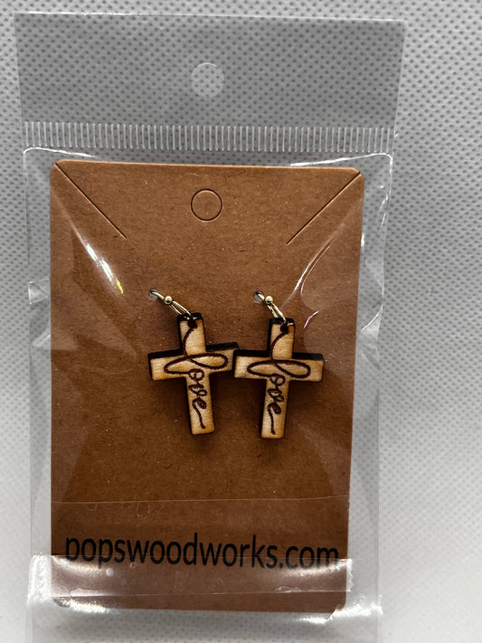 Cross earring set with the word love.